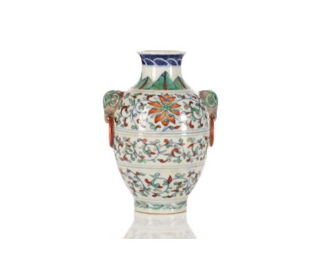 A Chinese porcelain Doucai vase, possibly republic period, the shoulder painted with leaves above light aubergine elephant ma