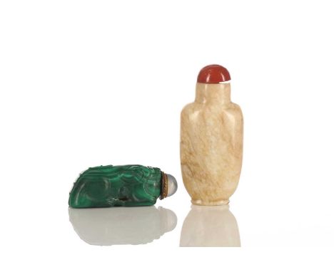 A Chinese chicken bone jade snuff bottle, carved in relief with a flowering tree; and a malachite snuff bottle, carved as a c