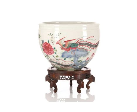 A Chinese Yongzheng style famille rose jardiniere, painted with two Fenghuang, with rockwork, tree peony and chrysanthemums, 
