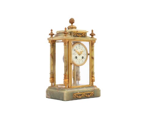 A French onyx and brass four-glass mantel clock, the circular painted enamel dial bearing Arabic numerals, 35 cm high x 20 cm