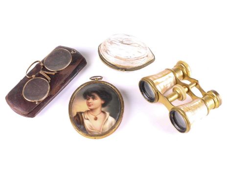 A small group of collectable items, comprising a pair of mother of pearl and brass cased opera glasses, a porcelain portrait 