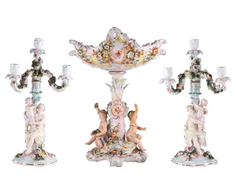 A pair of late 19th-century continental porcelain Sitzendorf figural four sconce table candelabra with floral encrusted decor