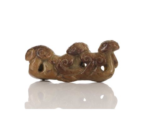 A Chinese jade brush rest, 20th century, carved as a group of lingzhi, the stone a pale green and brown, 13.5cmNo obvious fau