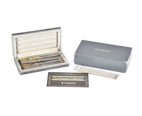 Four Parker Premier Collection sterling silver pens and a matching pencil, comprising fountain pen with 18ct gold nib, a roll