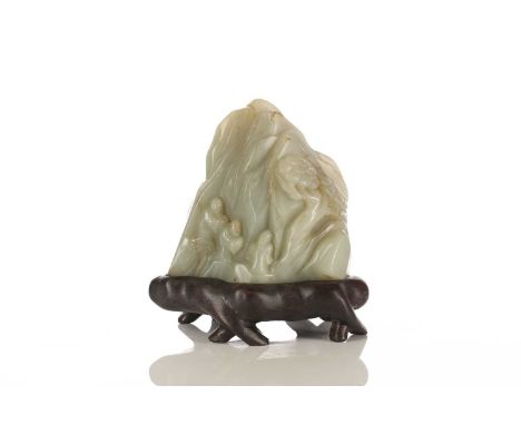 A jade boulder carving, Qing or later, carved with three scholars on a mountain path heading towards a pine tree, the stone a