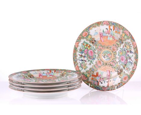 Five Chinese Canton famille rose plates, late Qing - early 20th century, painted with panels of conversing figures and birds 