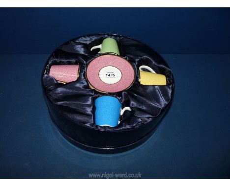 A boxed Royal Worcester set of four coffee cans and saucers in celebration of HRH 80th birthday.