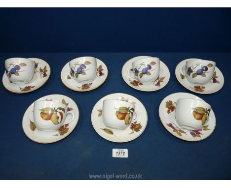 A quantity of Royal Worcester Evesham cups and saucers.