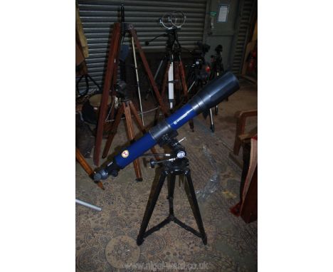 A large blue Bresser 70-70-0 Telescope with Bresser adjustable tripod.