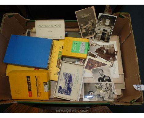 A quantity of old black and white photographs, ouija board, descant recorder, photographic paper, variety of postcards.