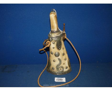 An unusual horn powder flask with inlaid studs, 9 1/2" tall.  