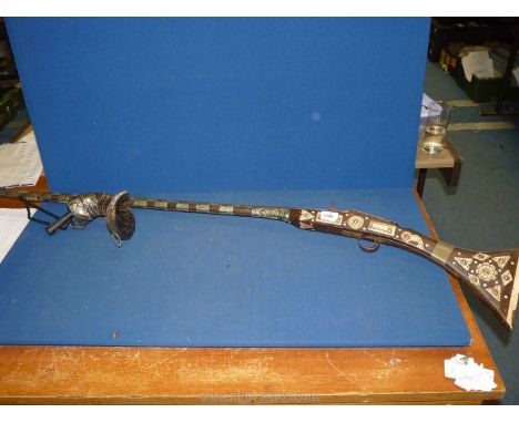 An 18th c. Arab flintlock camel musket with bone inlay and rams horn powder flask.  