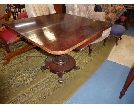 A 19th century Rosewood and Mahogany flap over Tea Table having a tapering turned pillar, the circular platform base raised o