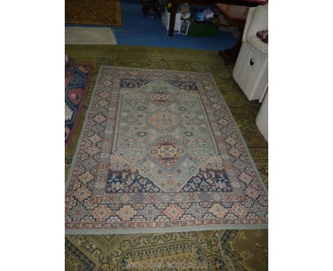 A light blue/brown rug with border pattern 92 1/2" x 63".