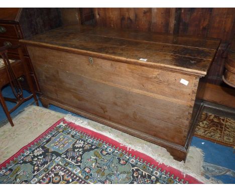 An appealing plain 19th c. Oak Coffer standing on bracket feet, 56'' long x 22 5/8'' deep x 26'' high.