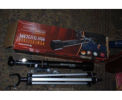 A Celestron Powerseeker 60 AZ 60 mm Telescope in box with attachments and tripod