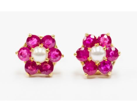 A pair of ruby and pearl earrings, flower cluster set with round cut rubies witha half pearl centre, diameter approx 9mm, 9ct