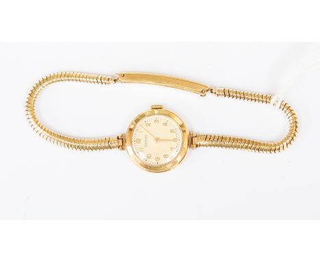 A 9ct gold Rotary ladies watch, round dial, case diameter approx 18mm, on a 9ct gold snake link bracelet, bar clasp, total gr