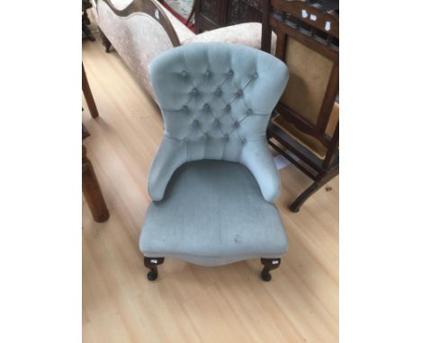 Blue velvet button back ladies chair.