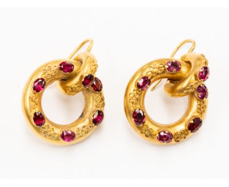 A Victorian pair of earrings, circular form set with oval amethyst and Etruscan revival filigree decoration, unmarked yellow 