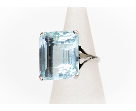 An aquamarine dress ring, step cut aquamarine measuring approx 17mmx 15mm, claw set in platinum, size H1/2, total gross weigh