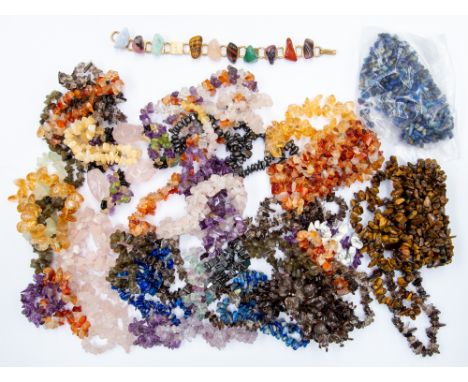 A collection of assorted gemstone chip elasticated bracelets, including carnelian and tigers eye multistrand cluster bracelet
