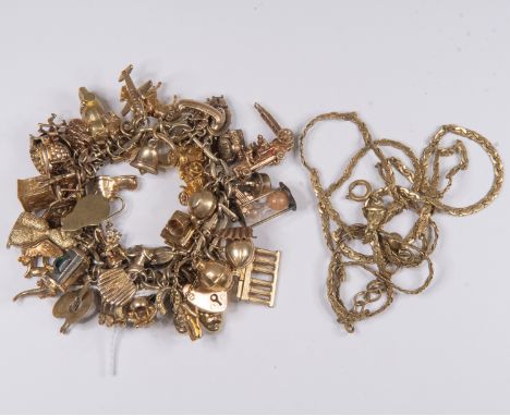 A 9ct gold charm bracelet with various 9ct gold and unmarked yellow metal charms, including poodle, egg timer, Beef-eater and