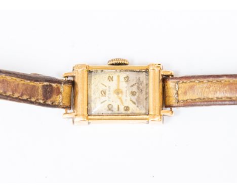 An 18ct gold Tegra watch circa 1930's rectangular dial on narrow leather strap A/F foxing discolouration to dial