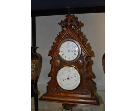 A late Victorian oak desk clock and barometer combined, of Gothic design, signed Hulme, Leamington, height 41cm