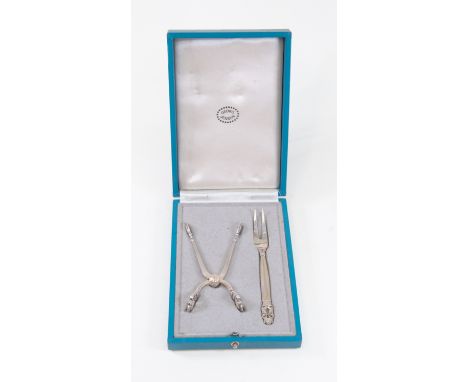 A Georg Jensen boxed silver sugar nip and fork in the Acorn pattern, oval dotted mark