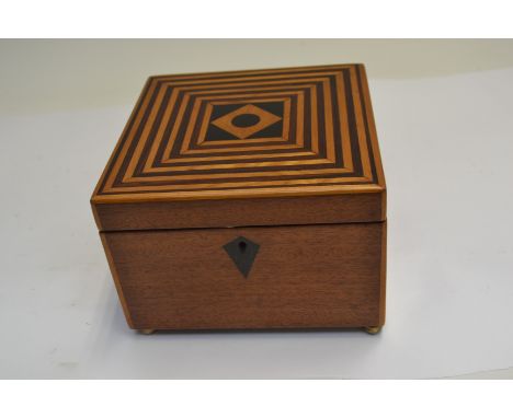 A 19th Century square parquetry inlaid tea caddy, single lidded division interior, brass ball feet&nbsp;