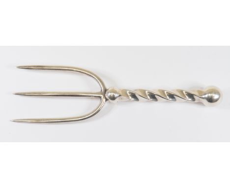 A white metal three prong meat or bread&nbsp; fork with barley twist handle&nbsp;