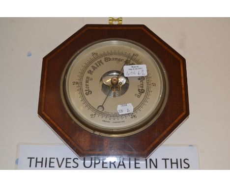 An Edwardian aneroid barometer and a bracket timepiece(2)