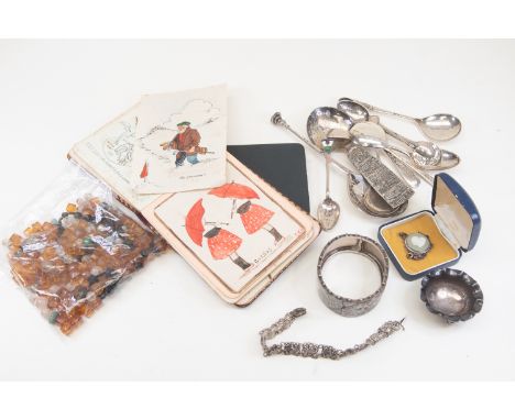 A collectors lot to include; a Victorian silver bangle; quantity of jet and amber type beads; two autograph books etc; a seal