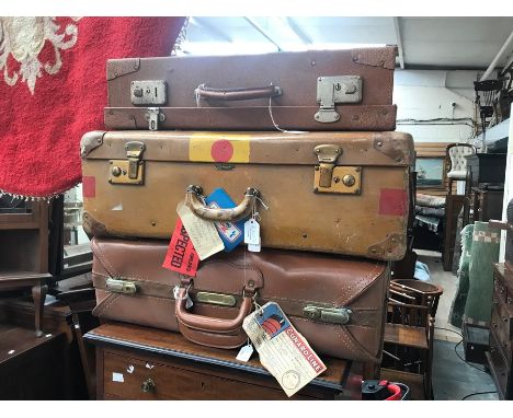 Three vintage suitcases, one with; "Cunard Line First Class" label on