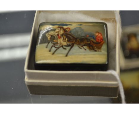 A Fedoskino Pegockuno Russian black lacquered papier mache patch box, of rectangular form with detachable lid, the top depict