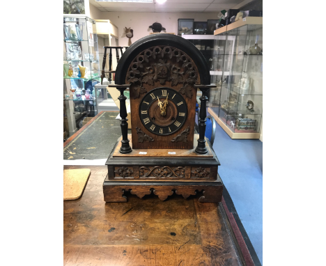 A late 19th Century cuckoo bracket clock, of Gothic design, height 50cm, width 38cm&nbsp;