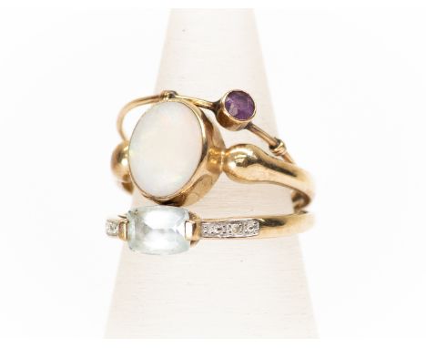 An opal and 9ct gold ring, oval white opal, rubover set, size Q1/2 along with a diamond and aqua coloured stone set ring, 9ct