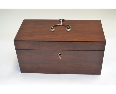 A George III mahogany tea caddy, cover swing handle, triple division interior,&nbsp;