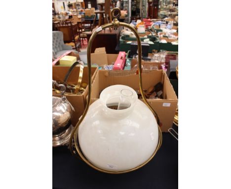 An early 20th Century hanging oil lamp with shade brass