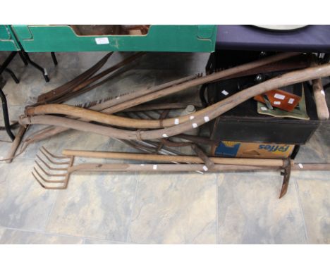 Collection of vintage tools, hand saws, garden tools, forks and scythe etc