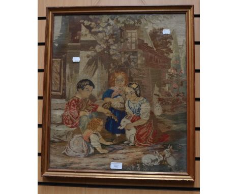 A 19th Century framed tapestry of children playing with a rabbit