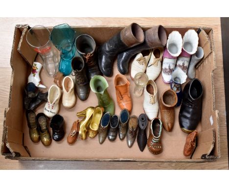 A collection of ornamental shoes and boots, including ceramic, crested ware, pin cushions, pottery riding boots, Victorian, E