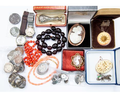 A collection of jewellery to include two gilt metal cameo brooches, carved brooch with unmarked rose metal border, a silver a