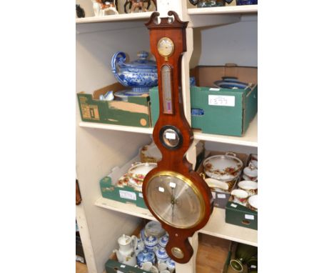 A 19th Century C. Collins mahogany aneroid barometer, incorporating a convex looking glass and spirit level