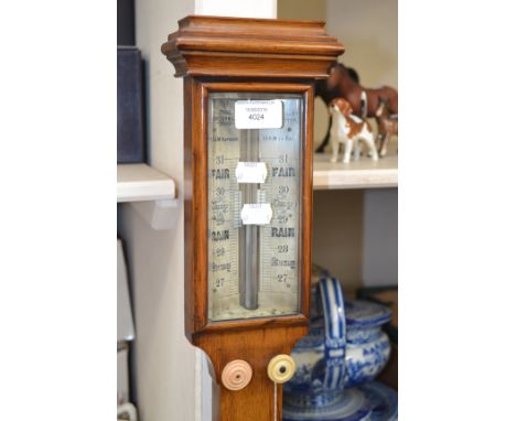 A 19th Century T. Underhill oak mercury stick barometer with ivory gauge, thermometer below 