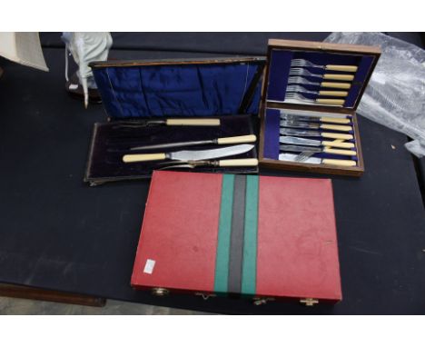 A set of six Victorian style chrome plated fish knives and forks, in fitted case; a cased set of stainless steel carving set 