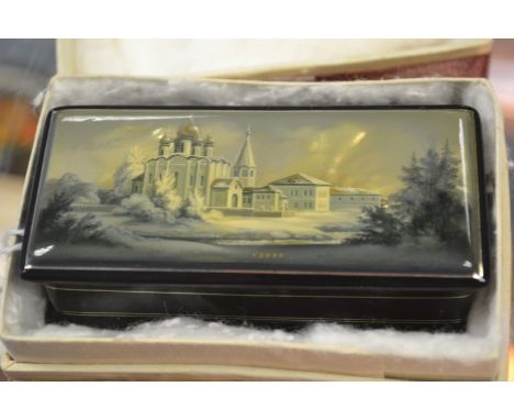 A Fedoskino Pegockuno Russian black lacquered papier mache, of oblong rectangular form with a hinged lid, hand painted depict