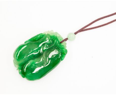 A carved jade pendant, with cord necklace, size approx 55mm x 37mm, total gross weight approx 53gms