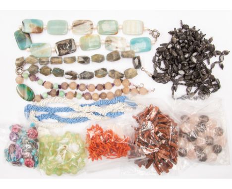 A collection of assorted gemstone necklaces, including a 20th Century coral single strand necklace, a jade type bead necklace